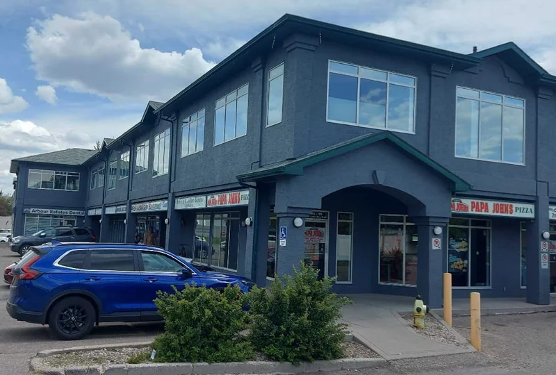 Repainted commercial plaza exterior in Calgary