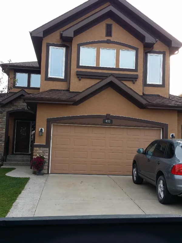 Repainted two-storey home exterior in Calgary